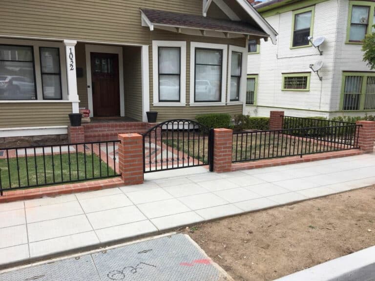 Wrought Iron Fence with Brick Columns